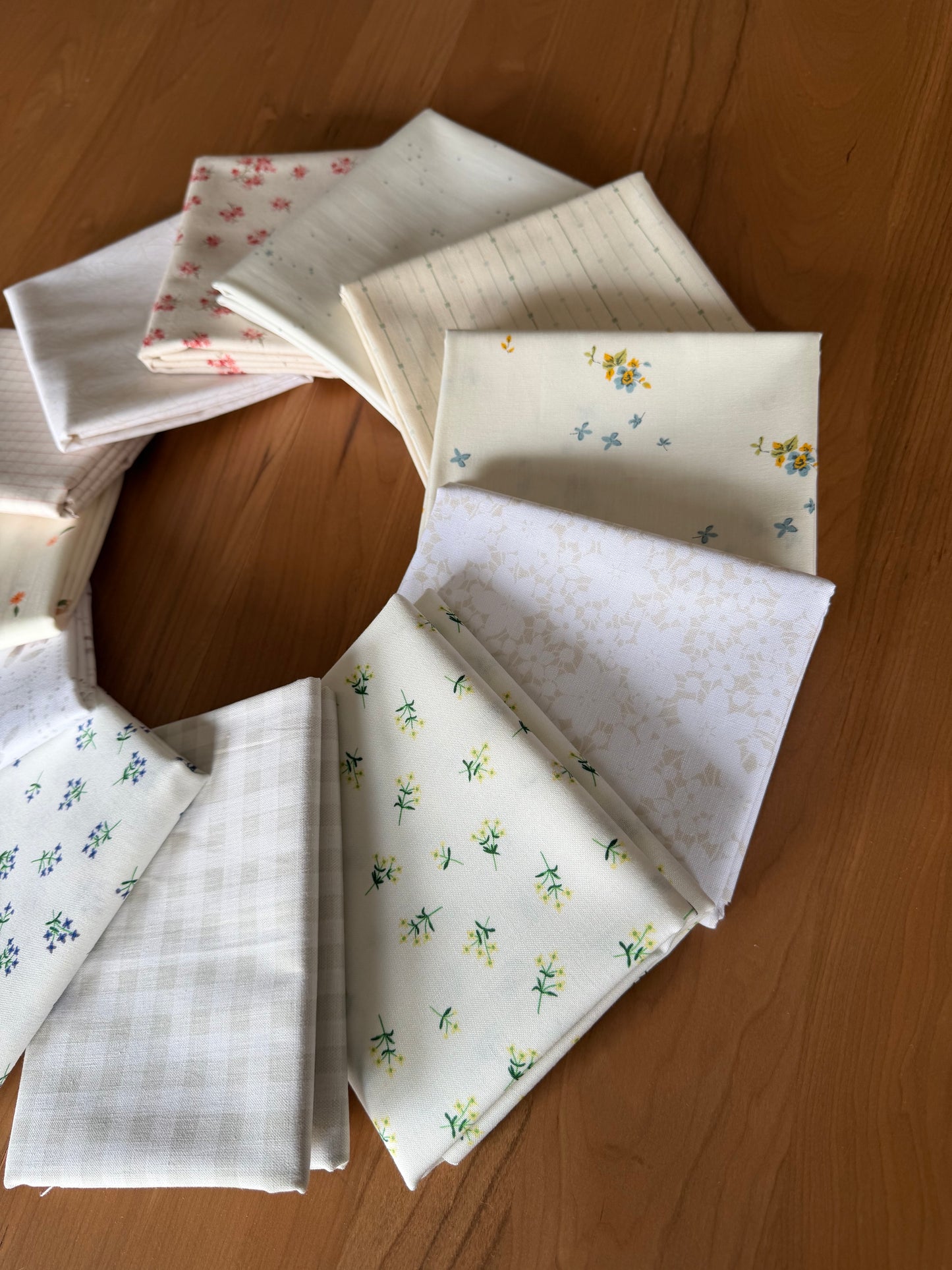 Collection of patterned fabric samples on a wooden surface